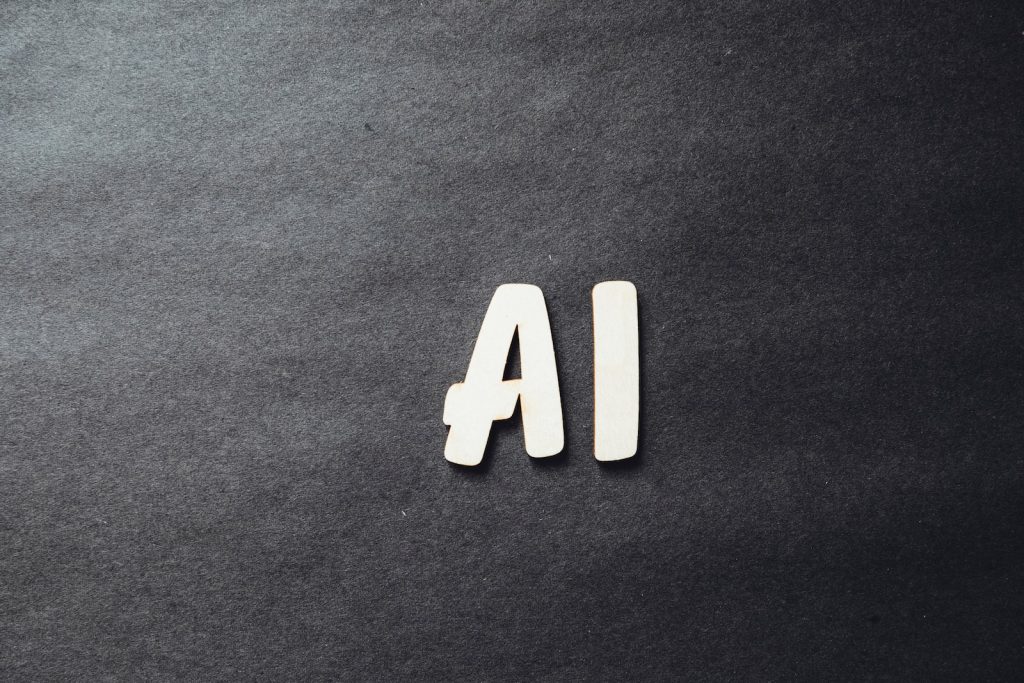 the word ai spelled in white letters on a black surface